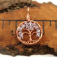 An image of the June birthstone tree of life pendant from Uncorked & Bottled Up on a ruler showing the size of the pendant